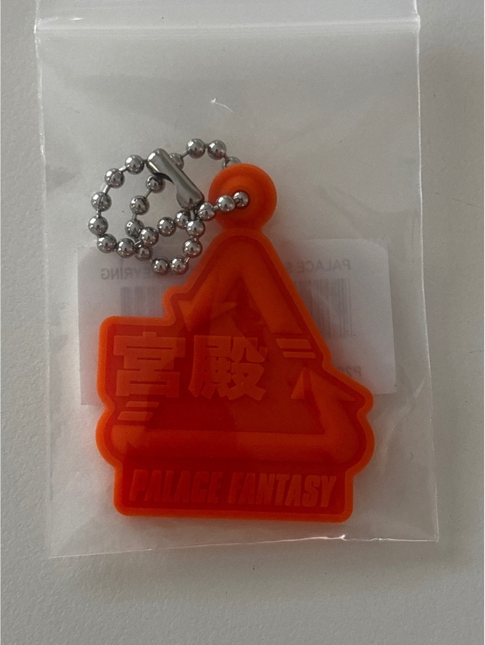 Palace x Sci-Fi Fantasy Tri Orange Rubber Keyring
